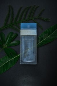 Dolce & Gabbana Light Blue perfume bottle with fresh green leaves | Aymaxblush