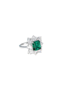 Emerald green gemstone engagement ring with sparkling diamond halo