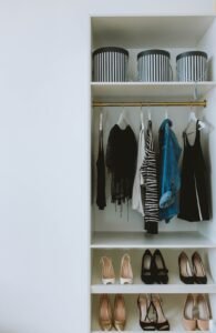 Organized fashion wardrobe essentials with clothes, handbags, and women’s shoes