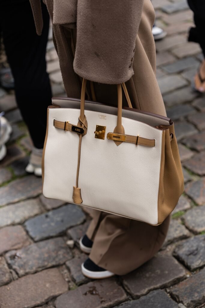 Luxury designer handbag in white and tan leather with gold hardware
