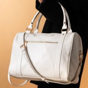 Elegant white leather handbag with gold hardware and shoulder strap