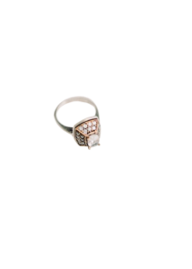 Elegant vintage-style engagement ring with a sparkling gemstone and intricate metal detailing