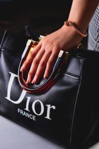 Black Dior luxury handbag with gold hardware and elegant styling